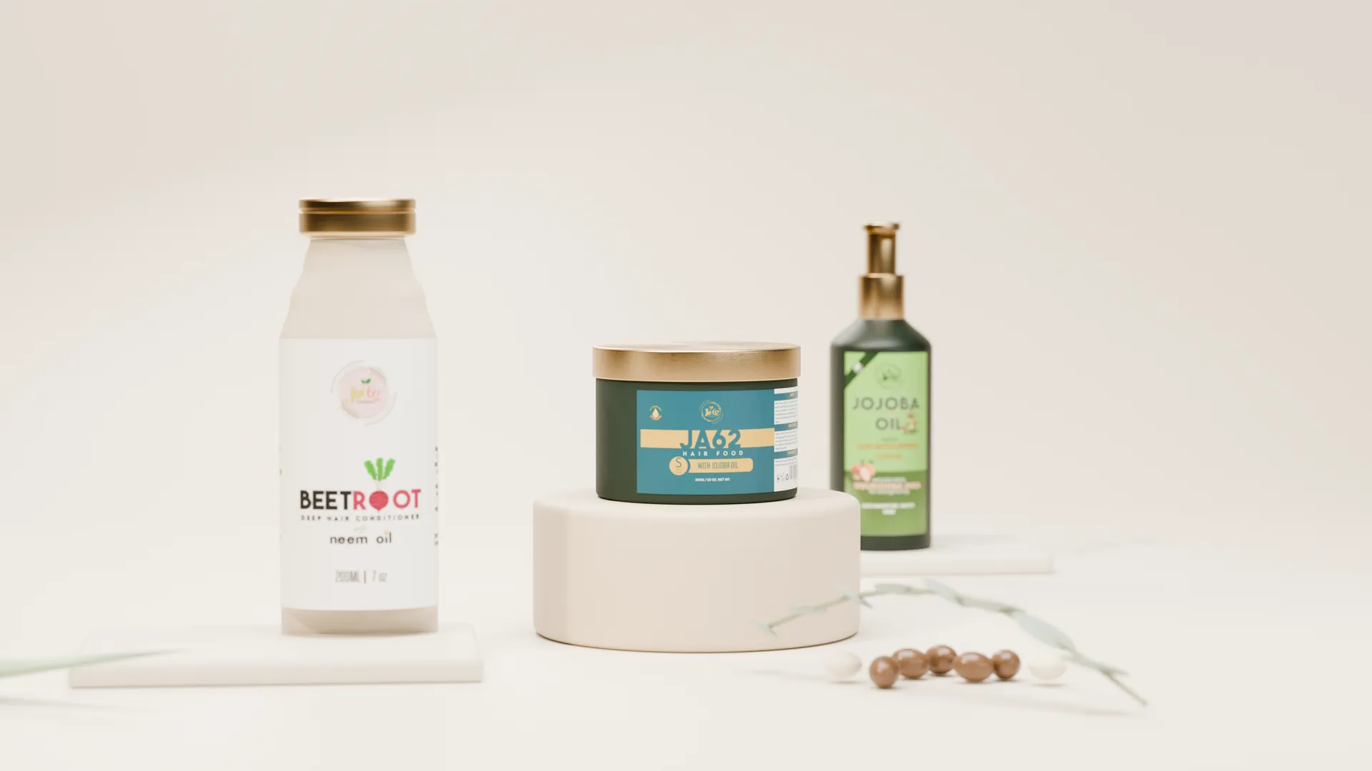 The JA62 collection — Hair Food, Jojoba Oil and Beetroot conditioner, styled on warm travertine under soft studio light